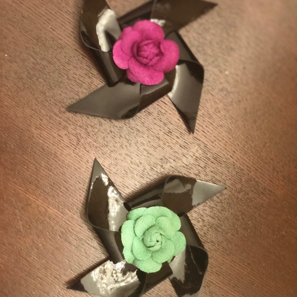 2 patent leather Chanel brooches